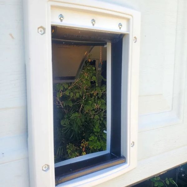Pet door installed in a garage door.