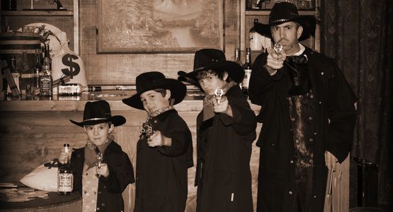 Dad and his gunslining outlaws. Ra=ealistic replica guns make boys of every age smile or not