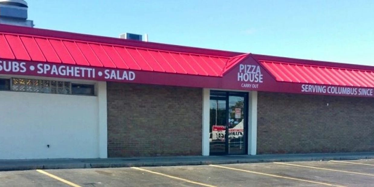 Pizza subs garage along with a big parking