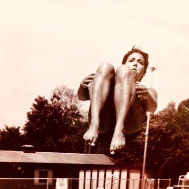 Girl jumping in pool
