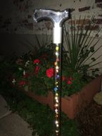 Walking cane with LED lights and multi-color silk roses. Available in 29" through 36" length. 