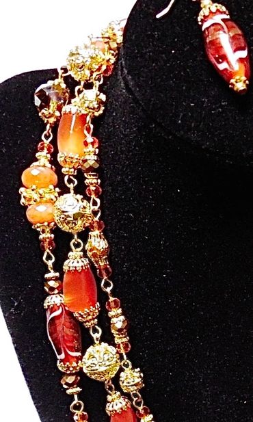 Genuine carnelian semiprecious stones, lampwork beads and gold plated findings (Artist: Donna Lea Mc
