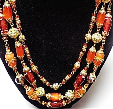 Genuine carnelian semiprecious stones, lampwork beads and gold plated findings (Artist: Donna Lea Mc