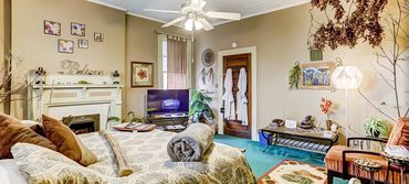 A photo from inside of the lovely Nature & Earth Room with water fountain and birds nest in a tree!