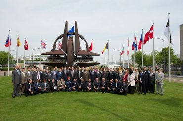 A photo in front of the NATO - OTAN Death Star display and monument.