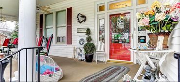 This red front door welcomes you and was designed by Chef Stormy Mongiello.