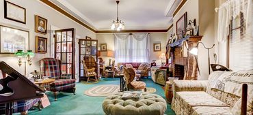 A photo of the indoor, air-conditioned lounge and fireplace.
