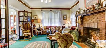 A photo of the indoor, air-conditioned lounge and fireplace.