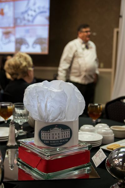A homemade chefs hat for centerpieces at a Chicago, Illinois dinner and keynote speech for 200.