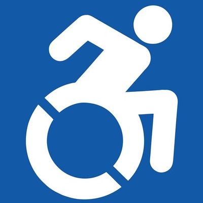 The ADA Accessible Icon in blue and white colors of a human in a wheelchair.
