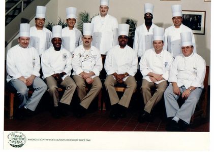 Marti Mongiello (center) graduates from the Culinary Institute of America.
