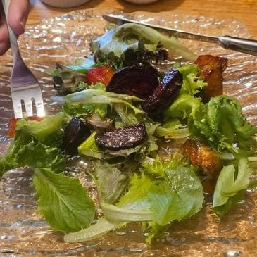 Chef Sanjeev Kapoor's Roasted Beet Salad with Orange Dressing over greens.