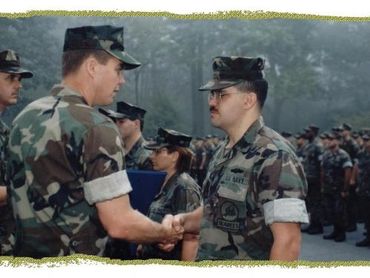 Admiral Cellon awarding Marti a Navy Achievement medal.