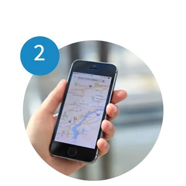 A person holding holding a phone showing the confirmation booked for a limo service in Houston, TX.