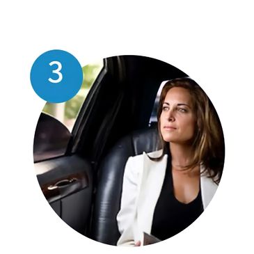 A female inside of a luxury limo enjoying their view while looking from the window in Houston