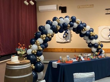 Beautiful navy, white, and gold balloon arch. 