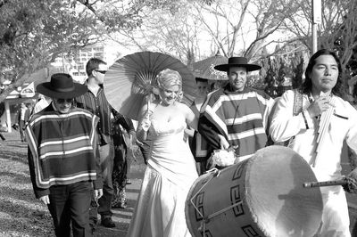 Couple in wedding procession with an Andes band.