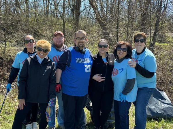 group of people posing after a cleanup