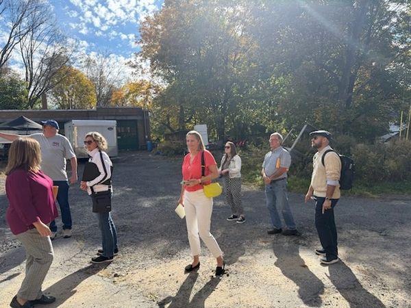 The group walking to the back of the building.