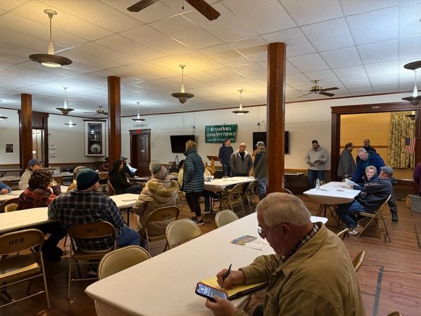 Community members listening to the proposed project.