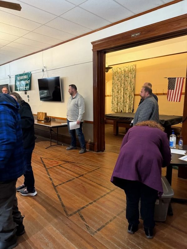 Community member signing into the public meeting.