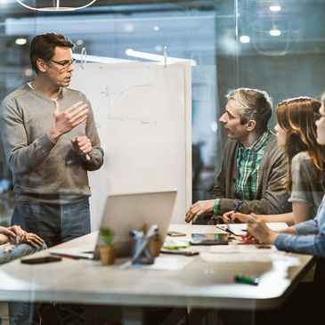 A group of people having a serious whiteboard session