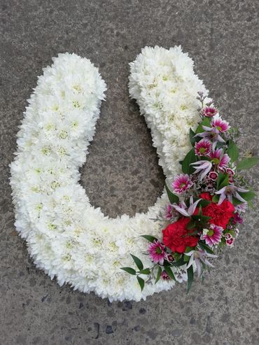 Horseshoe funeral flowers york