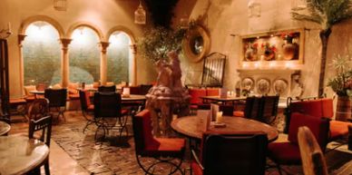Cozy indoor cafe with warm lighting and rustic decor.