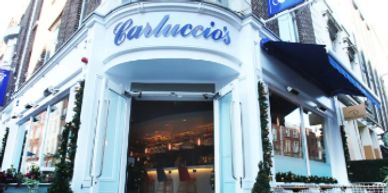 Exterior of Carluccio's restaurant with festive decorations.