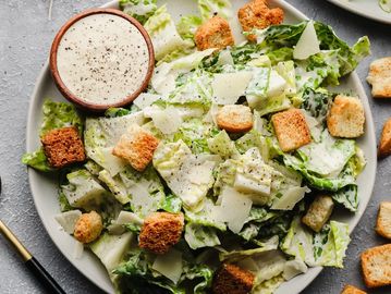 Fresh Caesar salad with romaine, croutons, parmesan, and creamy dressing.