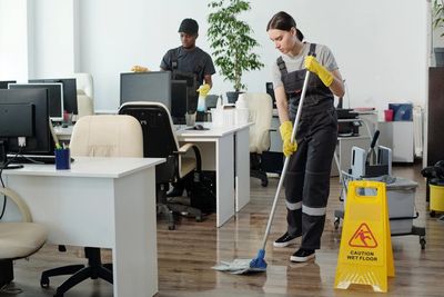 Team members cleaning the office