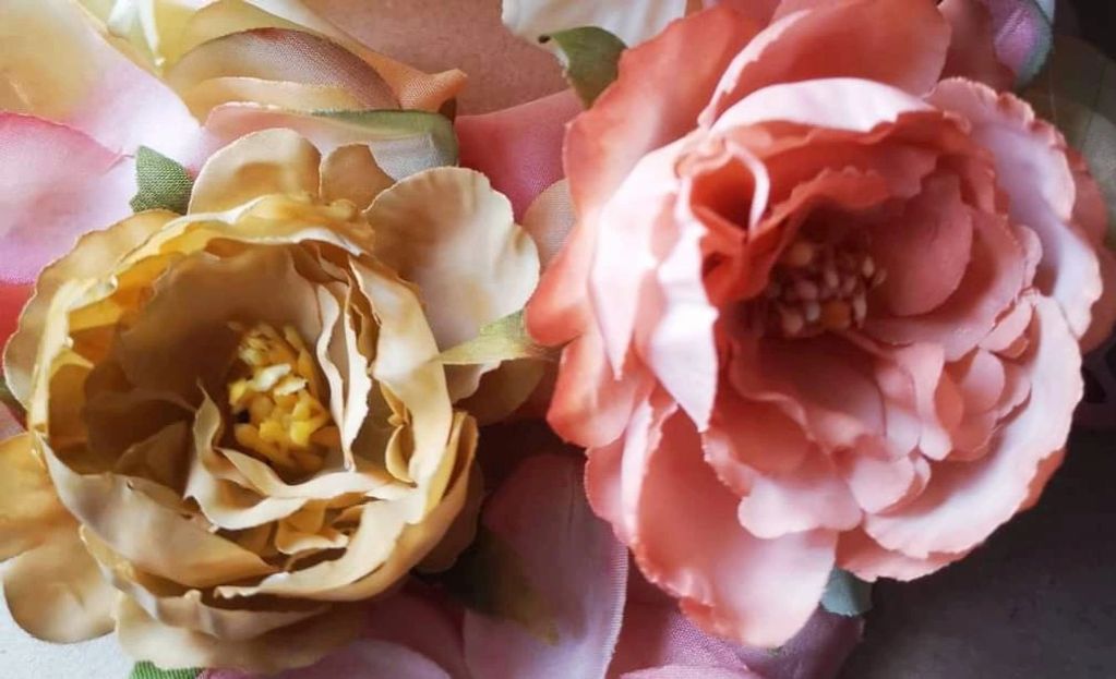 Hand painted & hand crafted faux flowers.
