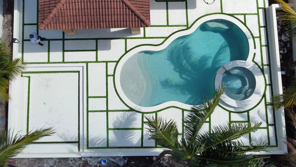 Modern concrete pool deck, with artificial grass.
Aventura, FL