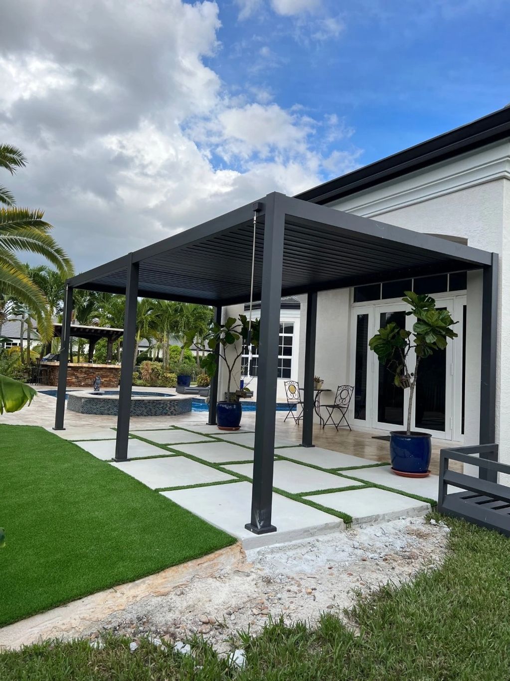 Concrete patio with artificial grass, and 10ft x 20ft Pergola addition.
Davie, FL
