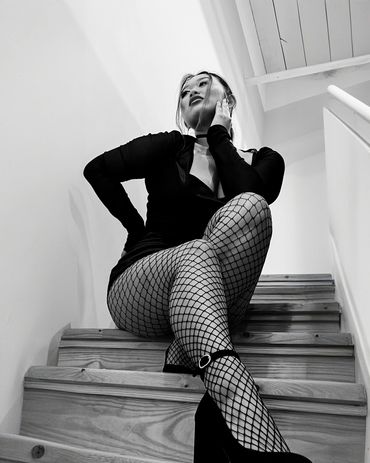 model girl sitting on the stairs