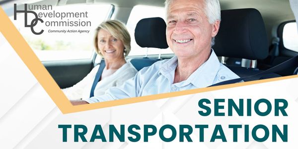 Two happy seniors in a car driving