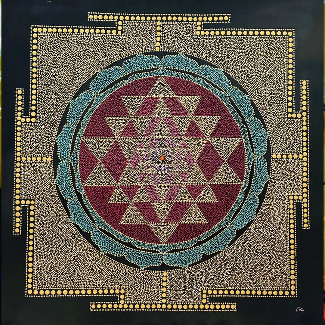 Stack of books next to pencils in a holder and a camera.