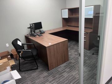 A modern 6x6 cubicle with 53-inch tall panels, featuring a sit to stand desk with 24x48