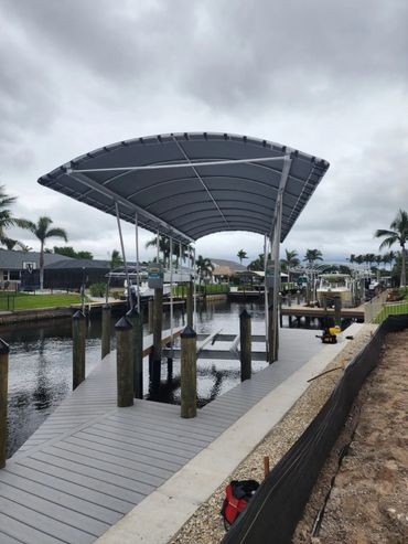custom dock with canopy and boat lift