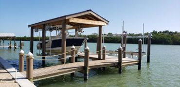 custom dock with canopy and boat lift
