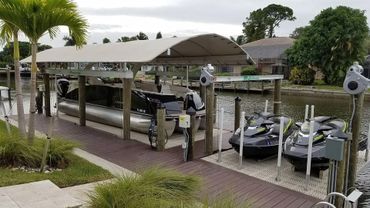custom dock with boat lift and jetski platform