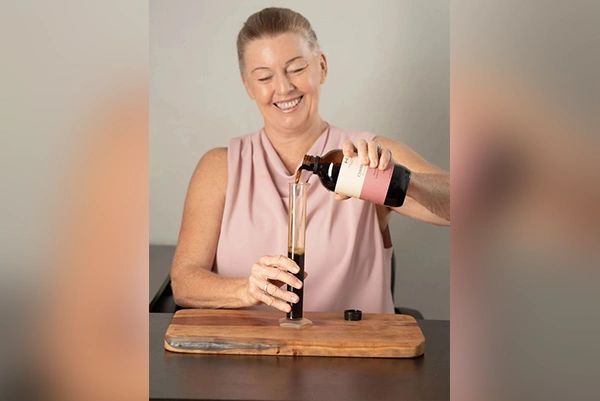 Leone Wilson naturopath pouring herbal medicines