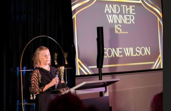 Leone Wilson delivering her Healthcare Hero acceptance speech on stage at the 2026 INSPiRE Awards.