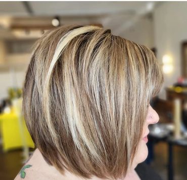 Romantic blonde curls with flower accent