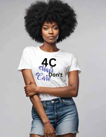 Confident woman with voluminous afro wearing a tee that says '4C Hair Don't Care'.