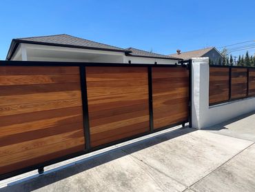 Custom sliding gate with redwood T&G wood