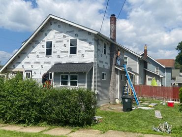 Repaired wall before siding installation in Akron