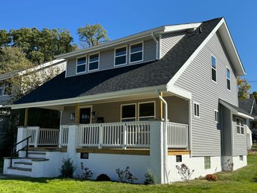 Vinyl siding replacement with new window trim