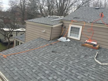 Steel roofing team explaining metal roofing costs in Canton, OH