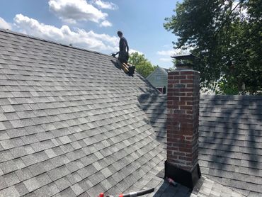 Akron home improvement team replacing old roof with modern materials